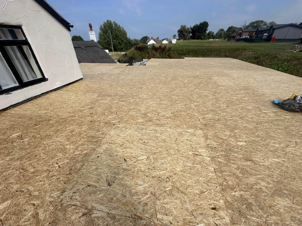 preparing a new flat roof on a house